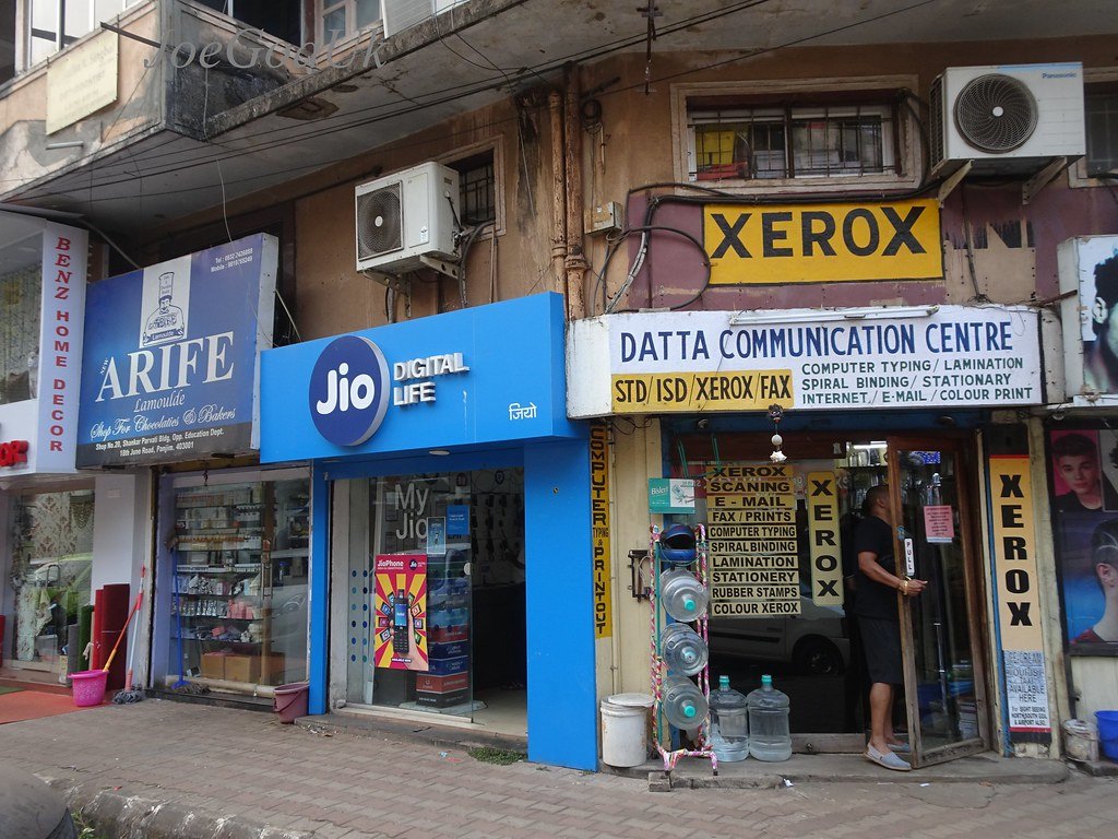 A blue Jio Digital Life store front on a street in Panaji, Goa